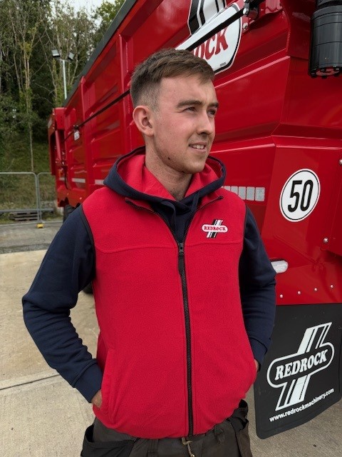 boy modelling the Kids Microfleece Bodywarmer in red with redrock logo embroidered in red and white